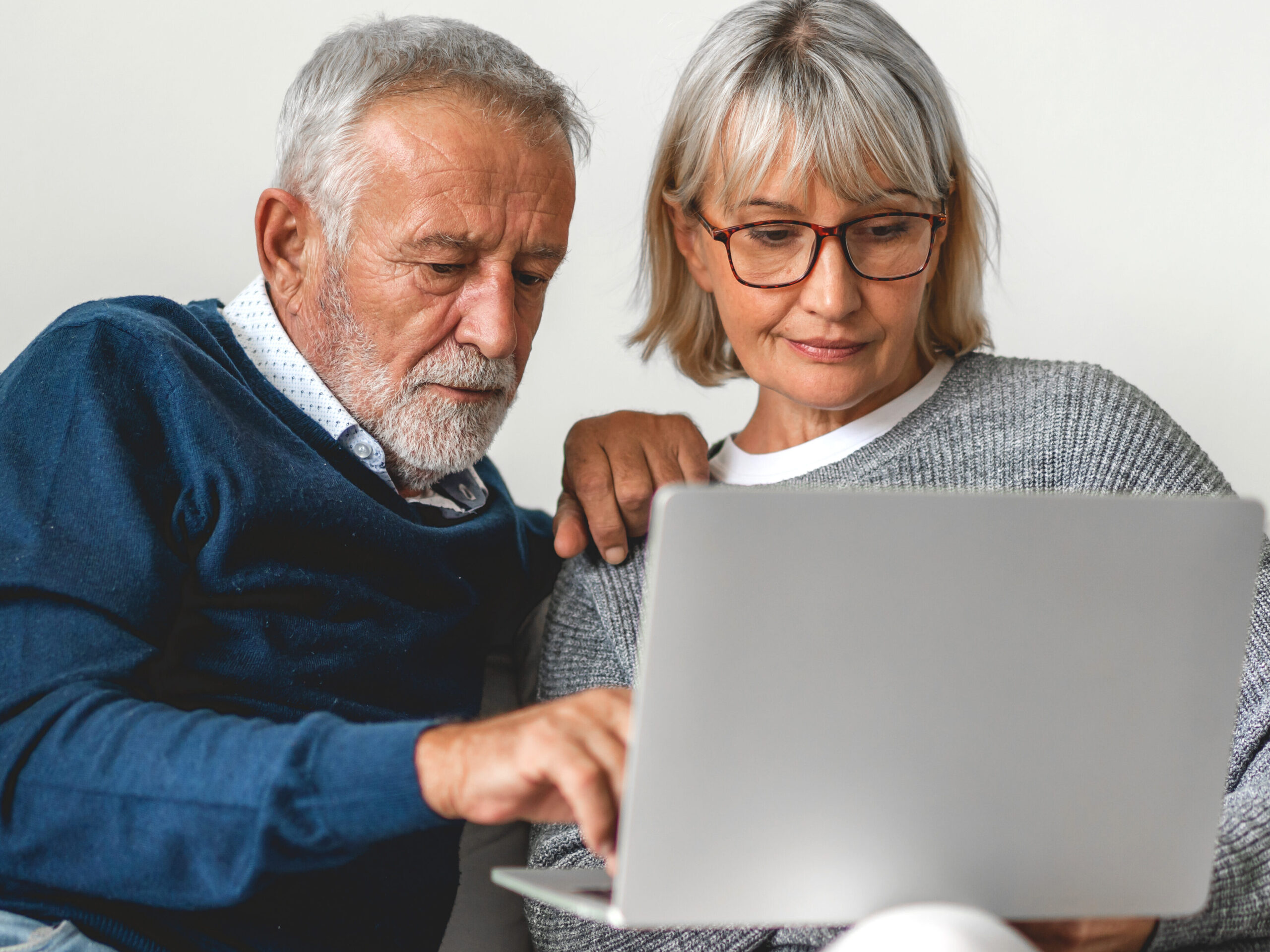 Two patients researching insurance coverage for Evoke Therapy closed‑loop spinal cord stimulation for chronic pain